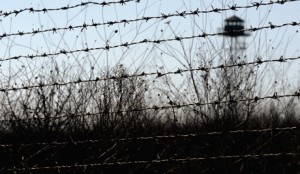 A watchtower is seen behind a wire fence on the border between Bulgaria and Turkey