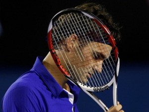 Switzerland's Federer looks on during his men's singles quarter-final match against Argentina's Del Potro at the Australian Open