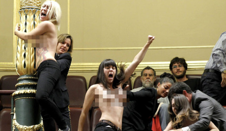 A pro abortion activists at the Parliament's Lower House in Madrid