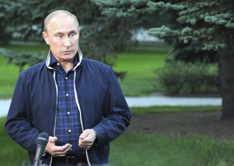 Russia's President Putin talks to journalists in Vladivostok